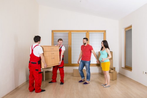 Unpacking boxes in a Barnsbury flat after moving day