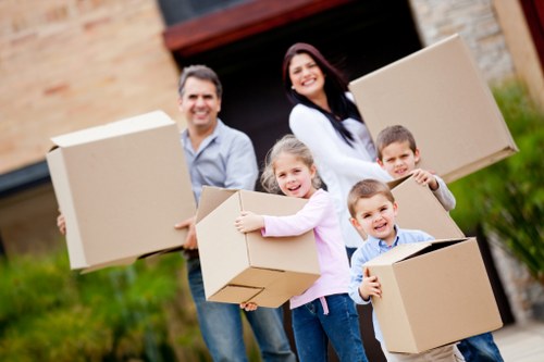 Local moving team handling boxes and furniture in Barnsbury