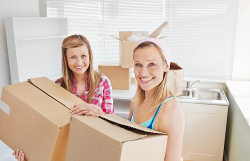 Barnsbury removal vehicle and movers handling furniture safely